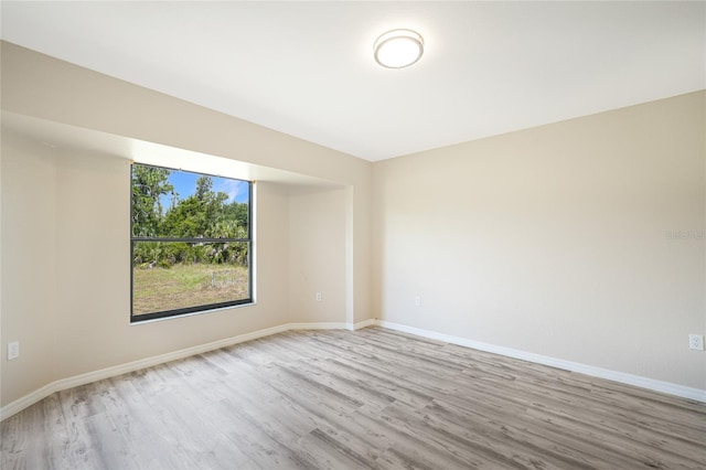 empty room with light hardwood / wood-style floors