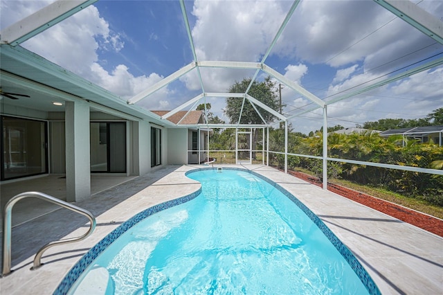 view of pool with a lanai and a patio area