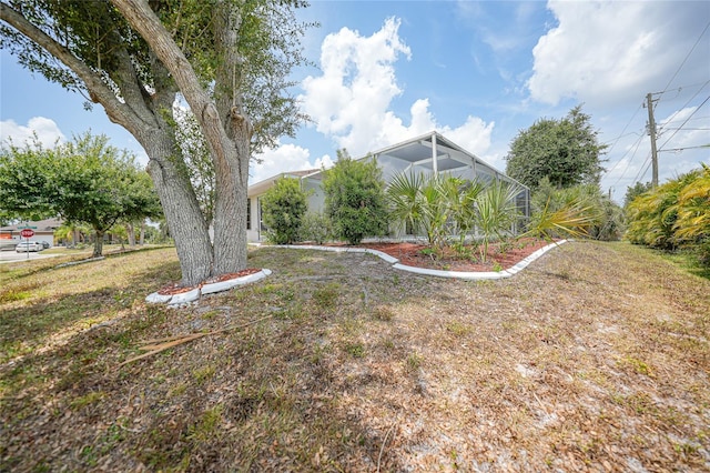 view of yard featuring a lanai