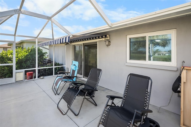 view of patio / terrace featuring a lanai