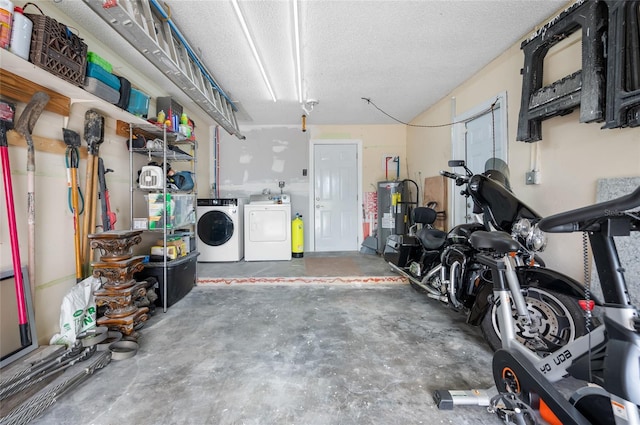 garage with washer and dryer and water heater