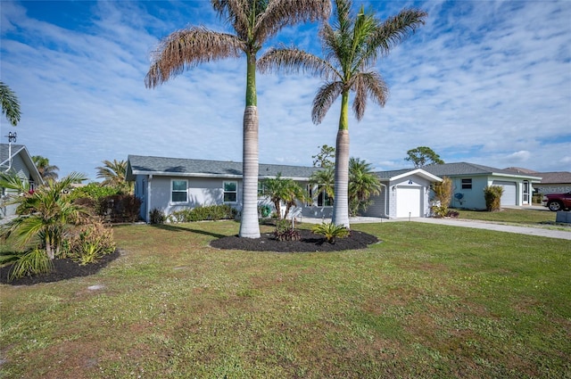 ranch-style home with a garage and a front lawn