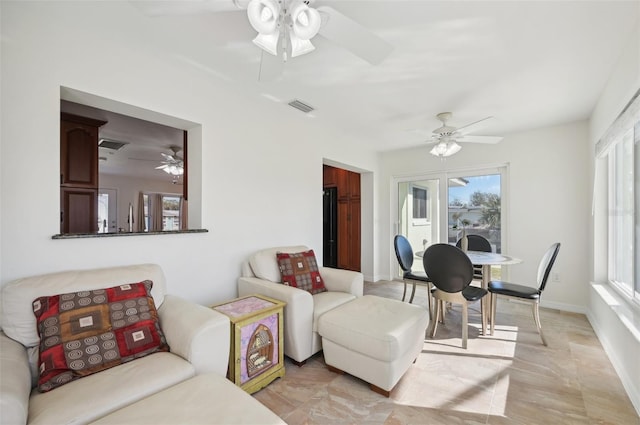 living room with french doors and a healthy amount of sunlight