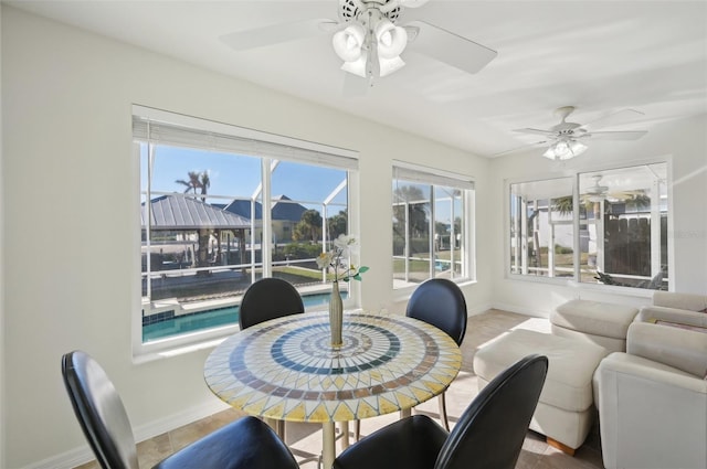 dining space with ceiling fan