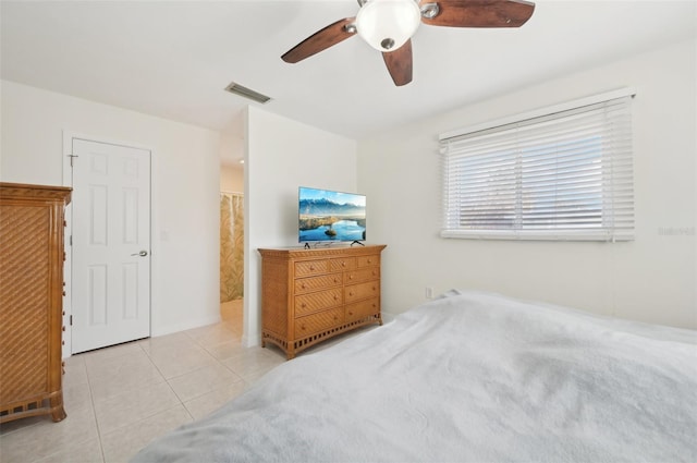 bedroom featuring ceiling fan and light tile patterned floors