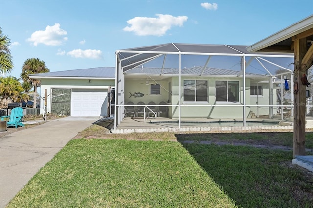 view of front facade featuring glass enclosure, a garage, and a front lawn