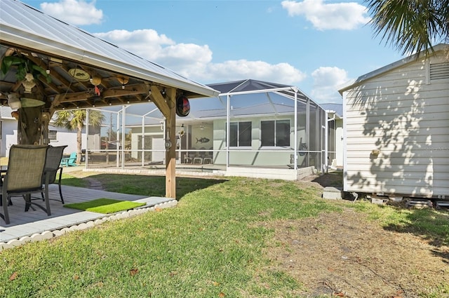 back of property featuring a lawn, a patio, and a gazebo