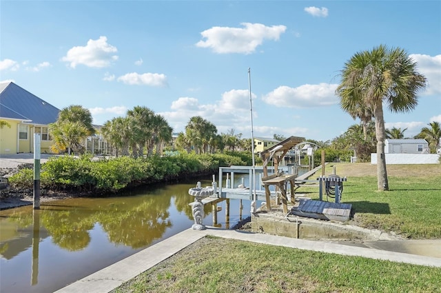 view of dock featuring a lawn and a water view