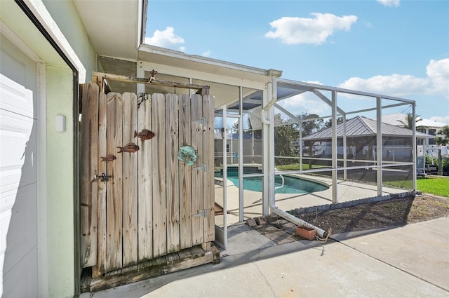 view of swimming pool with a lanai