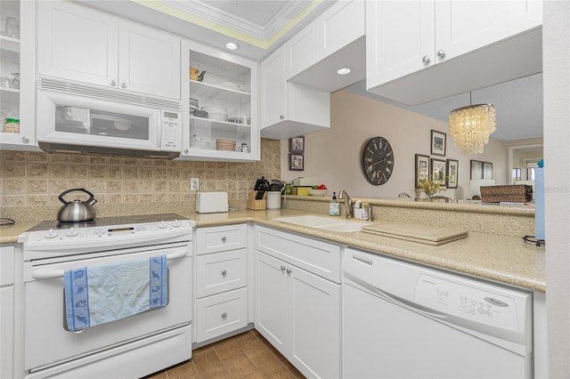 kitchen featuring sink, dark hardwood / wood-style floors, crown molding, white appliances, and white cabinets