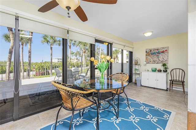 sunroom featuring ceiling fan