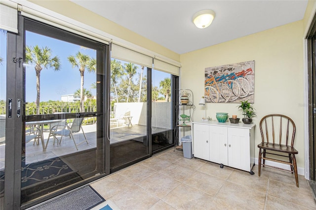 doorway featuring light tile patterned floors