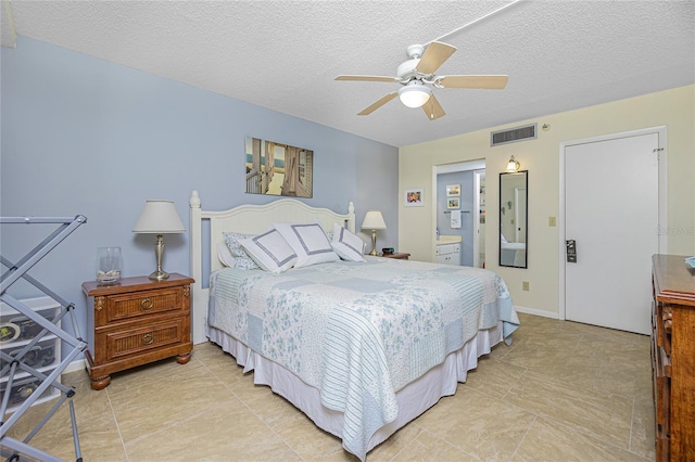 bedroom featuring a textured ceiling and ceiling fan