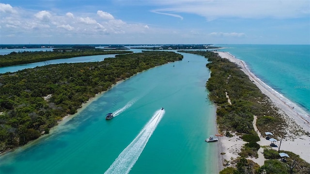 bird's eye view featuring a beach view and a water view