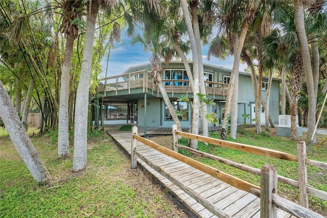 rear view of house with a wooden deck