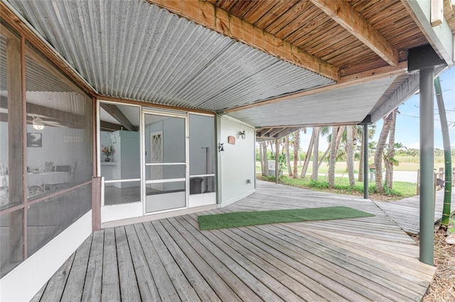 wooden terrace with a sunroom