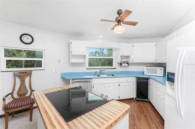 kitchen featuring white cabinets, light hardwood / wood-style floors, white appliances, and sink