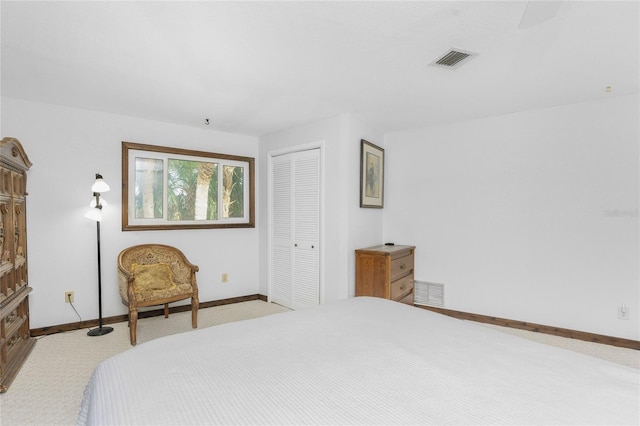 carpeted bedroom with a closet