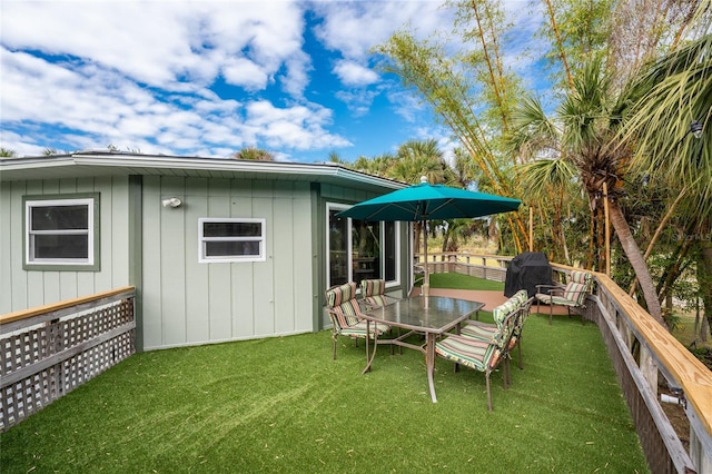 exterior space with a lawn and a wooden deck