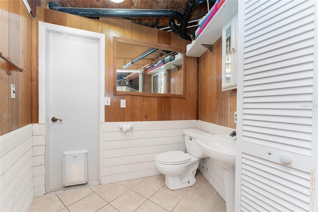 6341 Biggs St, Englewood, FL 34224 - half bath featuring wooden walls and tile patterned flooring