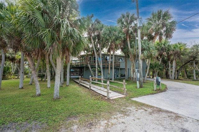 view of property's community with a yard and a wooden deck