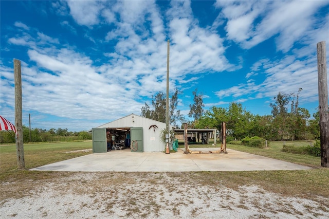 6341 Biggs St, Englewood, FL 34224 - view of pole building with a yard