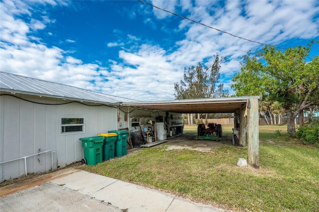 view of car parking with a lawn and a carport