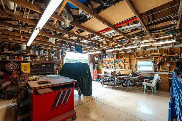 6341 Biggs St, Englewood, FL 34224 - garage with a workshop area and ceiling fan