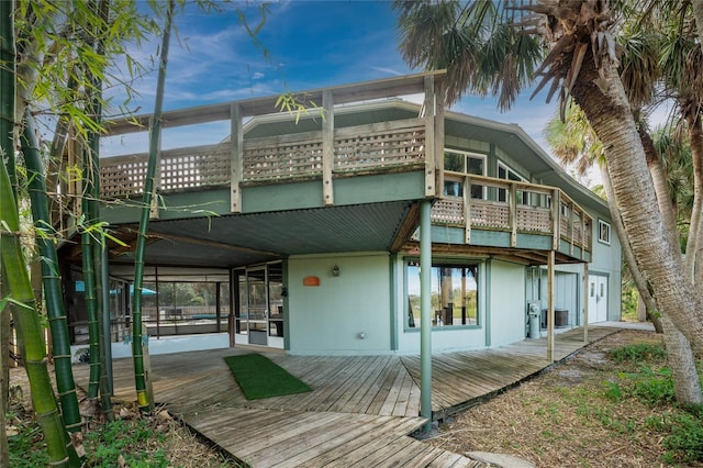 6341 Biggs St, Englewood, FL 34224 - rear view of house featuring a deck and a balcony
