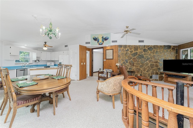 6341 Biggs St, Englewood, FL 34224 - dining space with ceiling fan, lofted ceiling, a chandelier, and light colored carpet