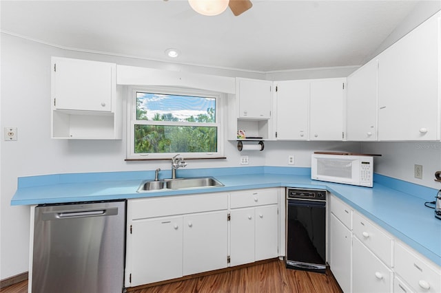 6341 Biggs St, Englewood, FL 34224 - kitchen with stainless steel dishwasher, open shelves, white microwave, and white cabinetry