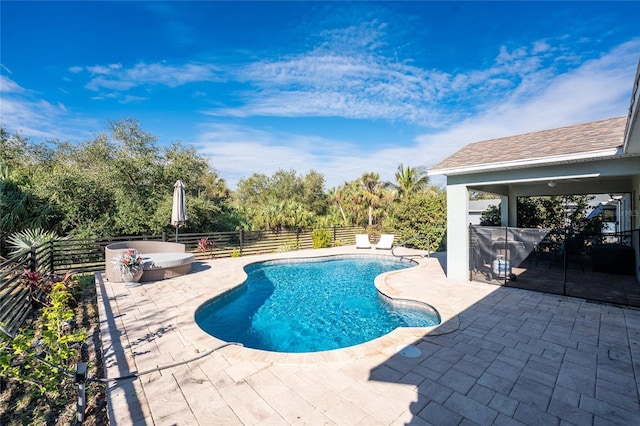 view of pool featuring a patio area and a hot tub