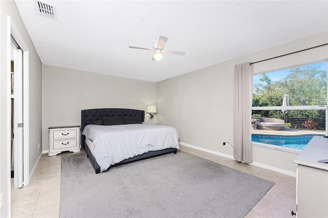 tiled bedroom with ceiling fan