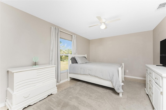 bedroom featuring ceiling fan and light carpet