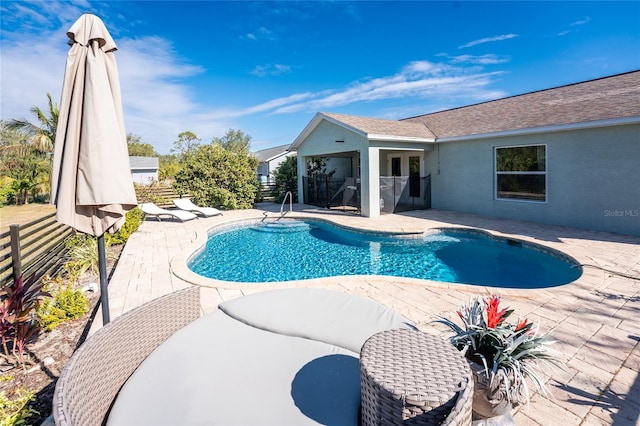 view of swimming pool featuring a patio area