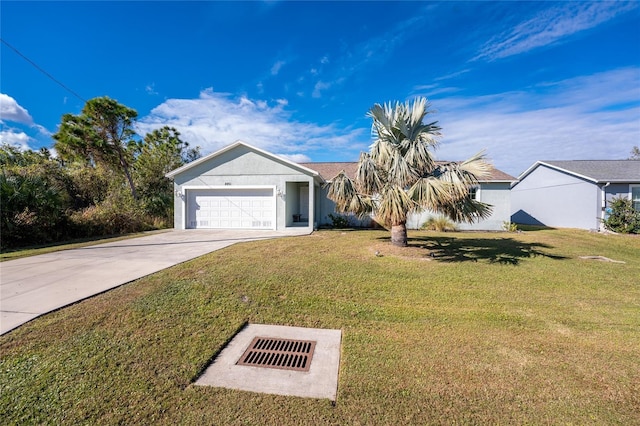 view of front of property featuring a garage and a front lawn