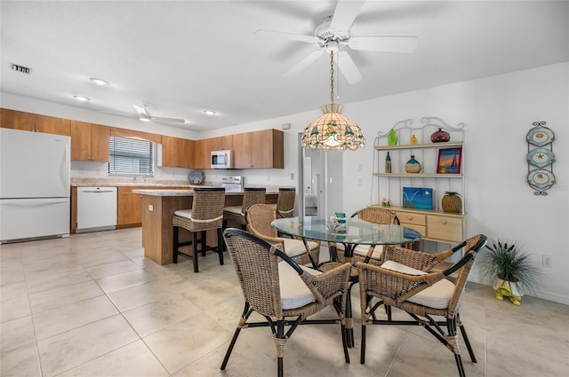 tiled dining area with sink