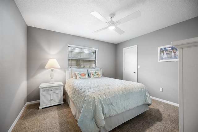 bedroom with carpet flooring, ceiling fan, and a textured ceiling