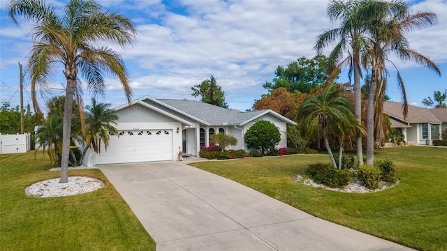 ranch-style home with a garage and a front lawn