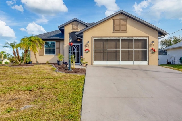 single story home featuring a front lawn and a garage