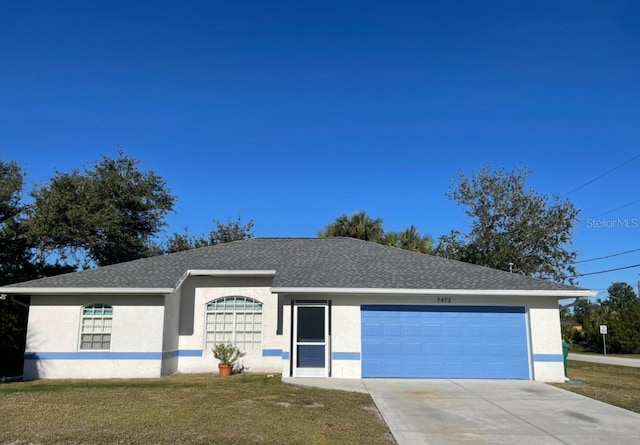 single story home with a front lawn and a garage