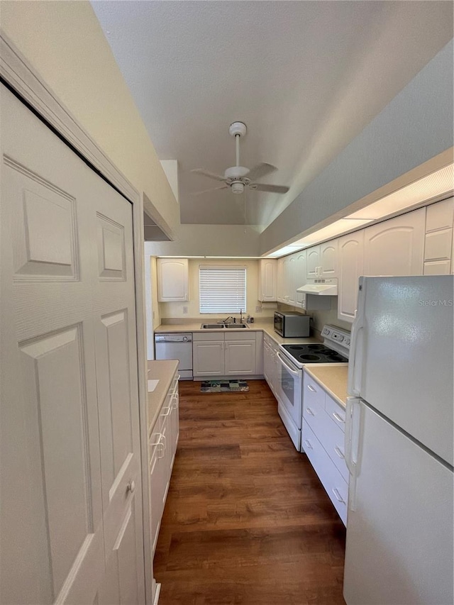 kitchen with white cabinetry, ceiling fan, dark hardwood / wood-style floors, white appliances, and lofted ceiling