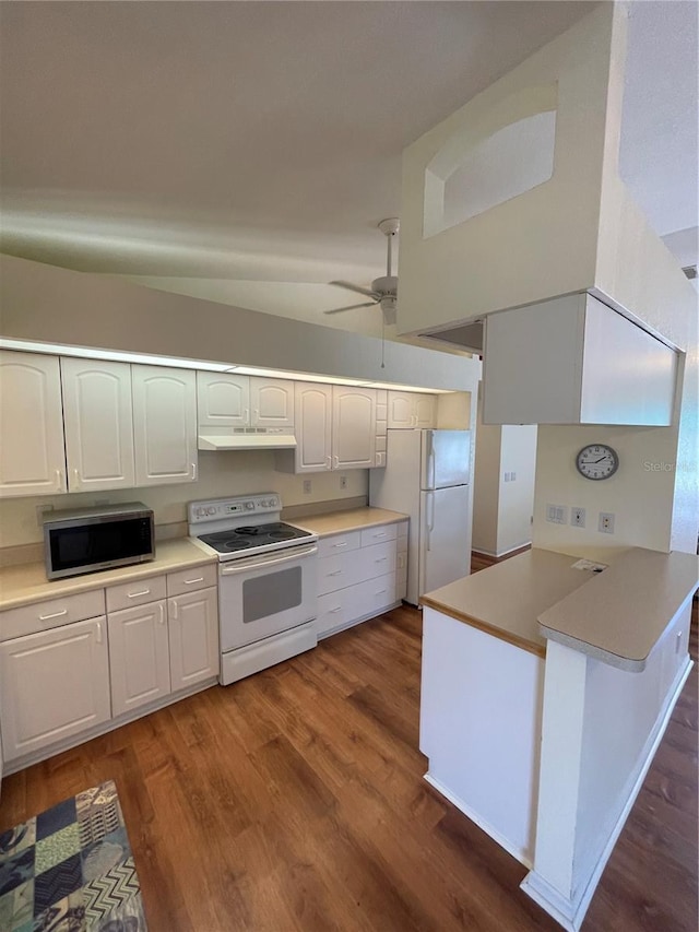 kitchen with ceiling fan, dark hardwood / wood-style floors, kitchen peninsula, white appliances, and white cabinetry