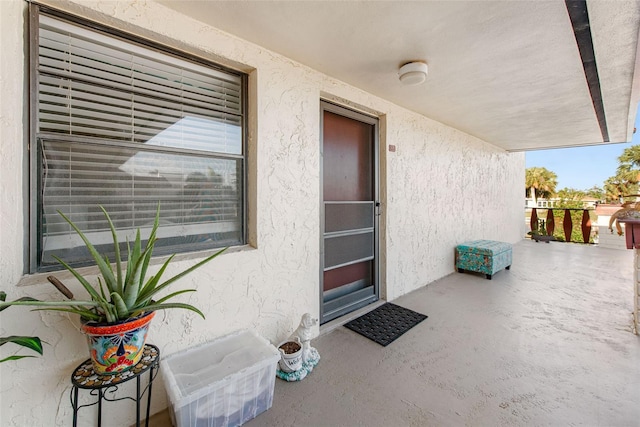 property entrance with covered porch