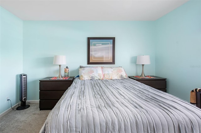 bedroom featuring light colored carpet