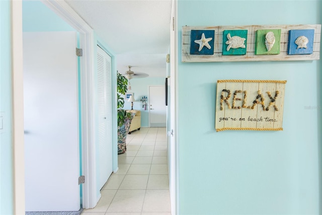 hallway with light tile patterned floors