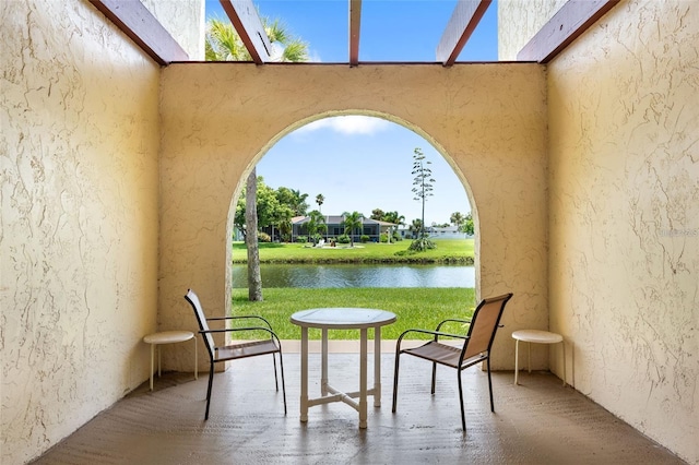 view of patio / terrace with a water view