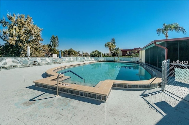 view of swimming pool with a patio