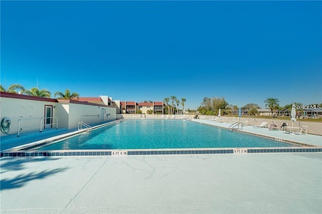 view of pool featuring a patio