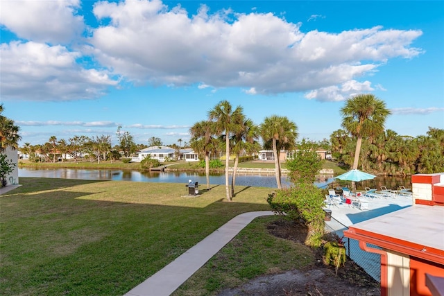 view of yard featuring a patio area and a water view